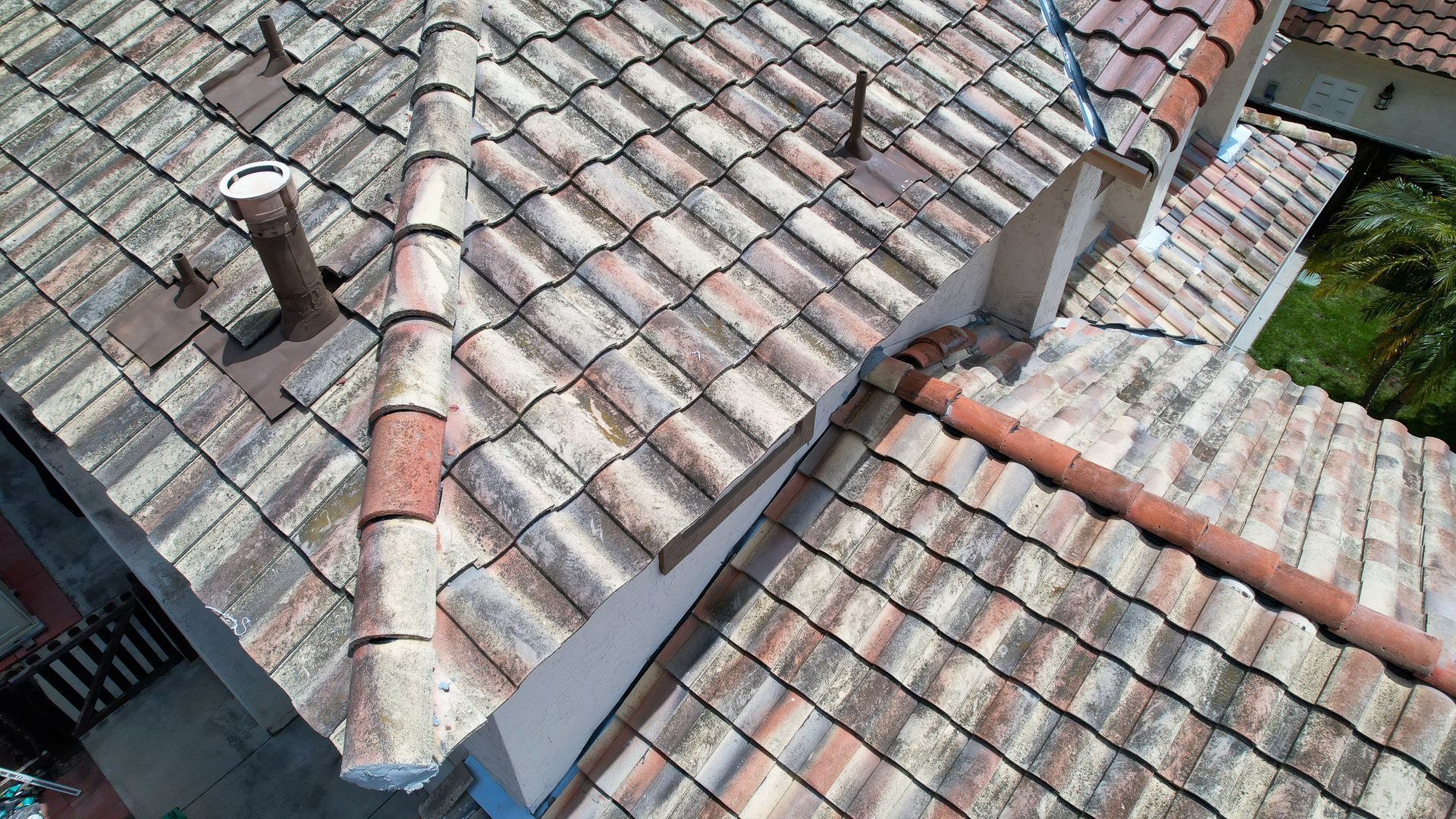 An aerial view of a tiled roof of a house