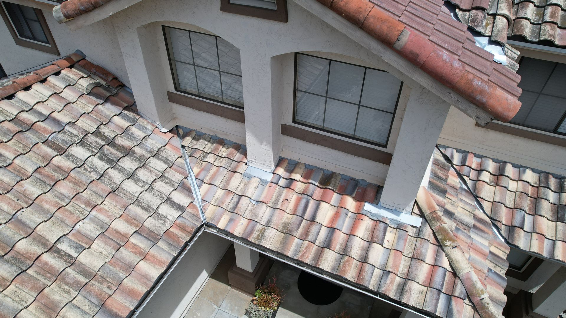 An aerial view of a house with a tiled roof