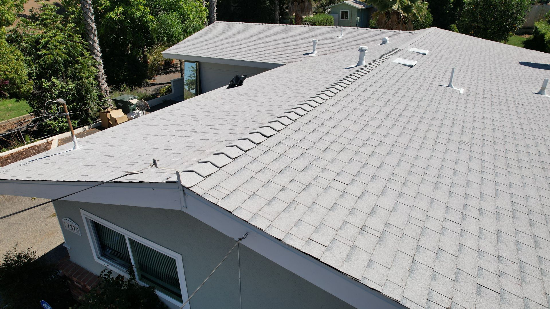 A house with a roof that has a lot of shingles on it