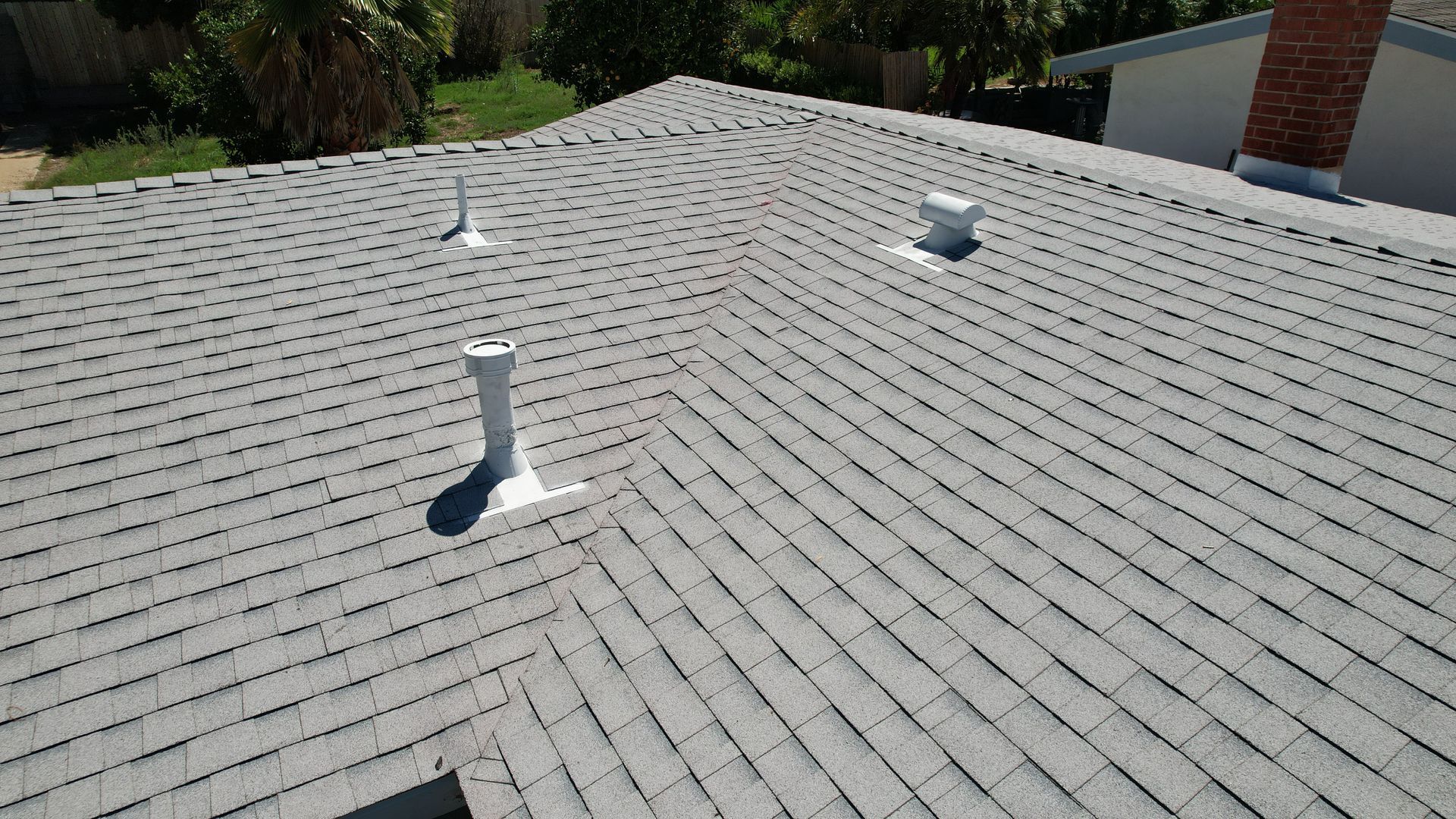 The roof of a house with a chimney on it