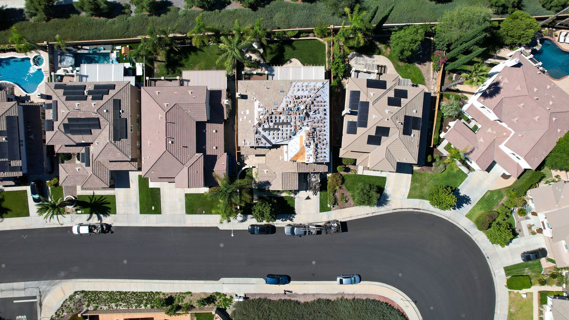 An aerial view of a residential neighborhood with lots of houses