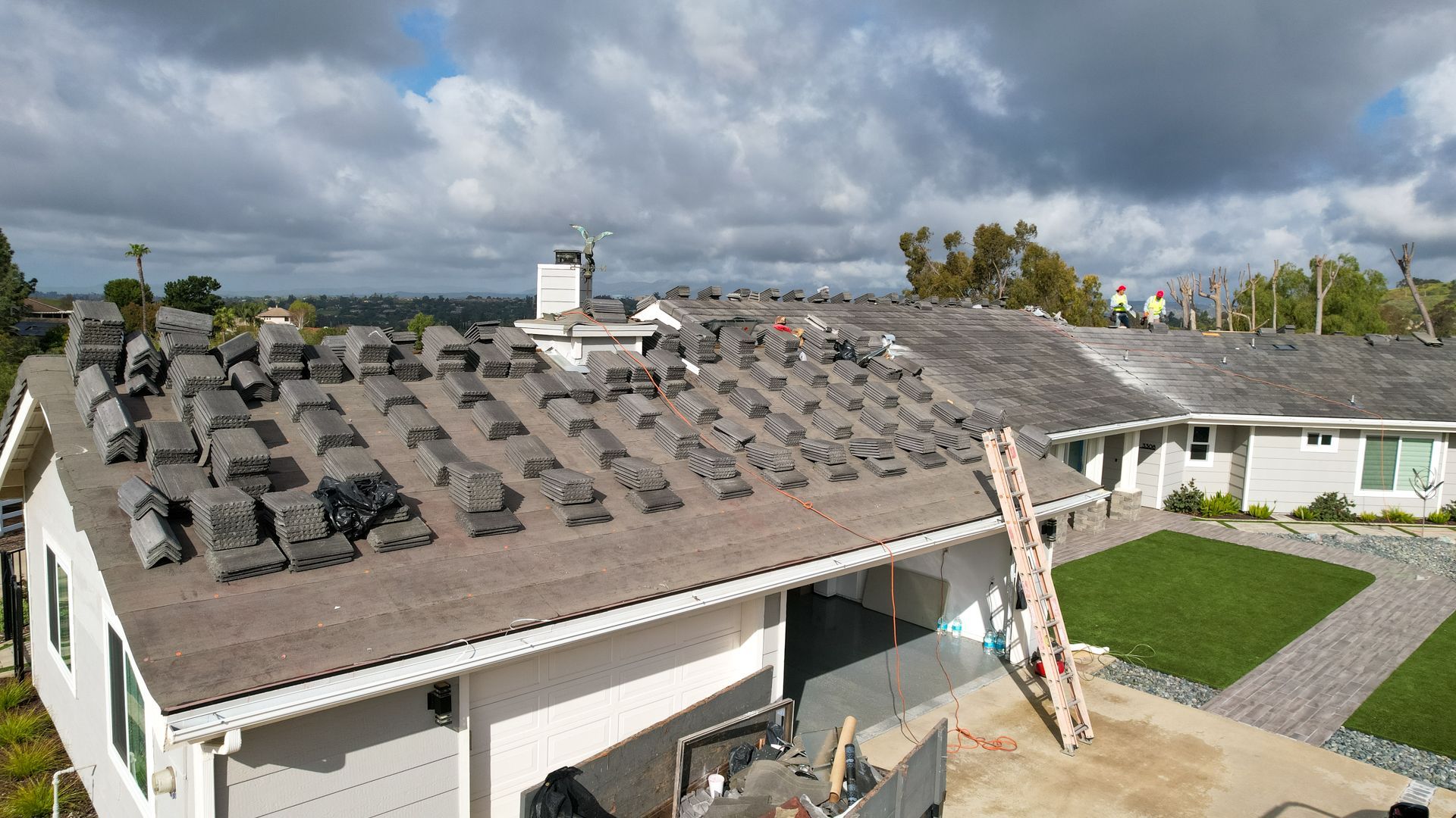 A house with a lot of shingles on the roof