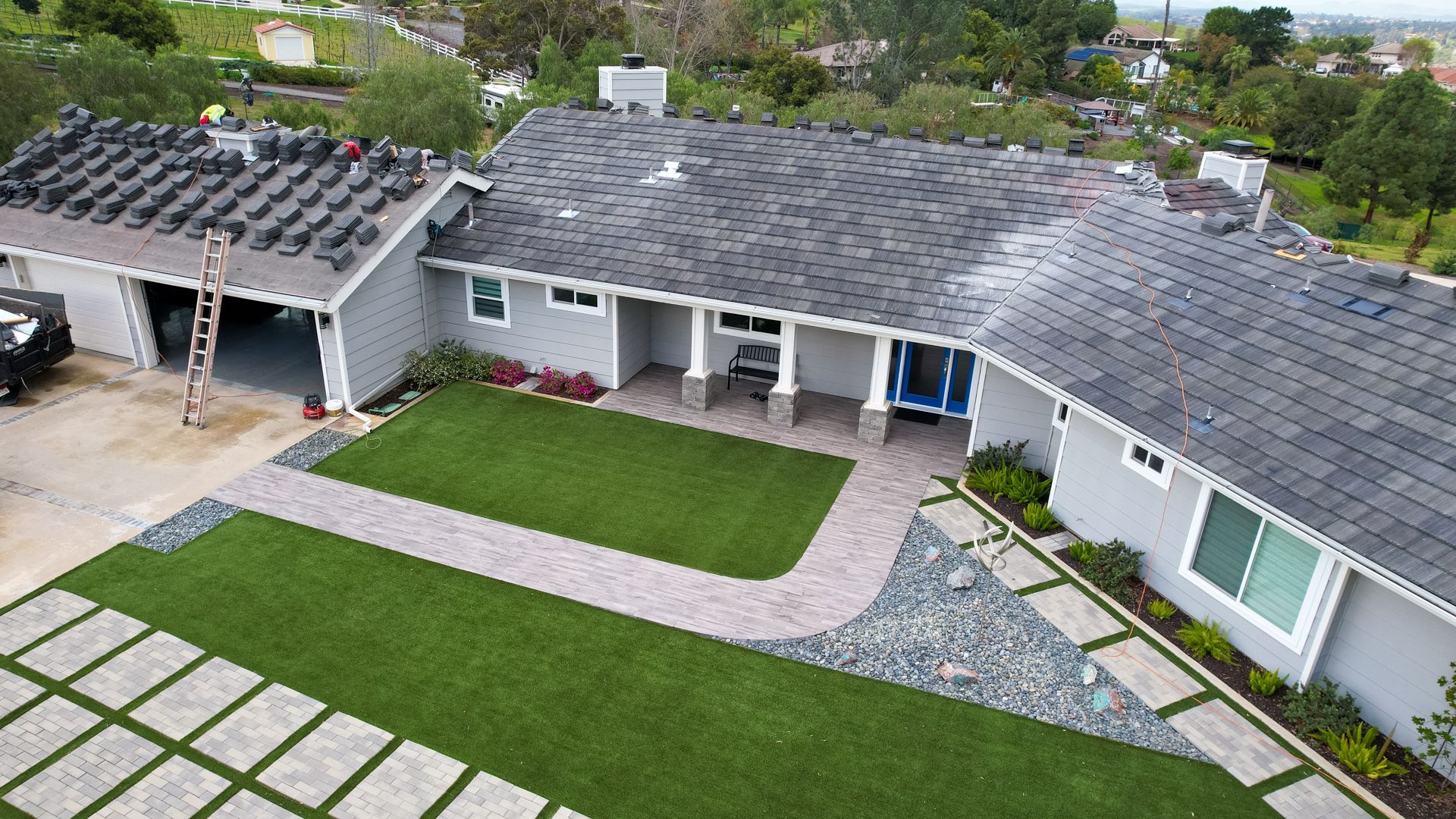 An aerial view of a house that is being remodeled