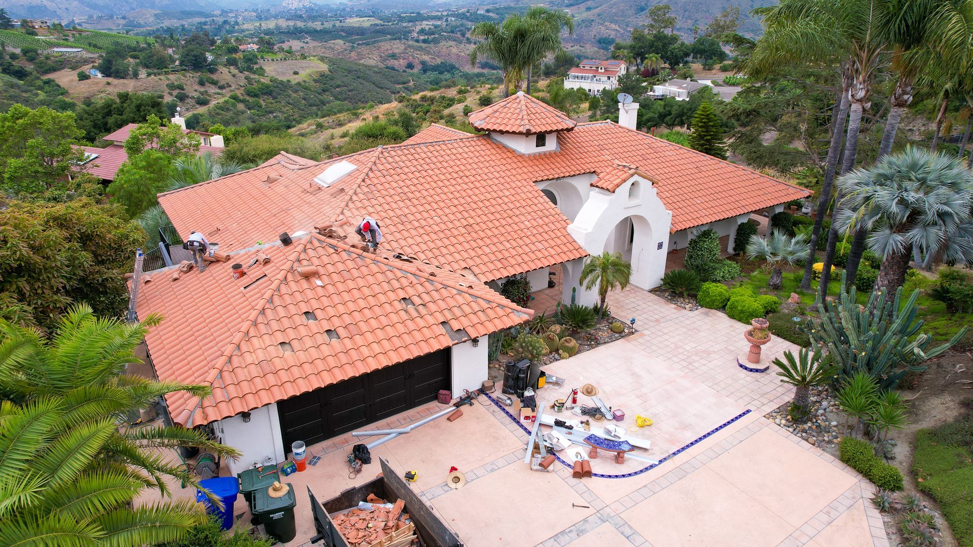 An aerial view of a house with a red tiled roof