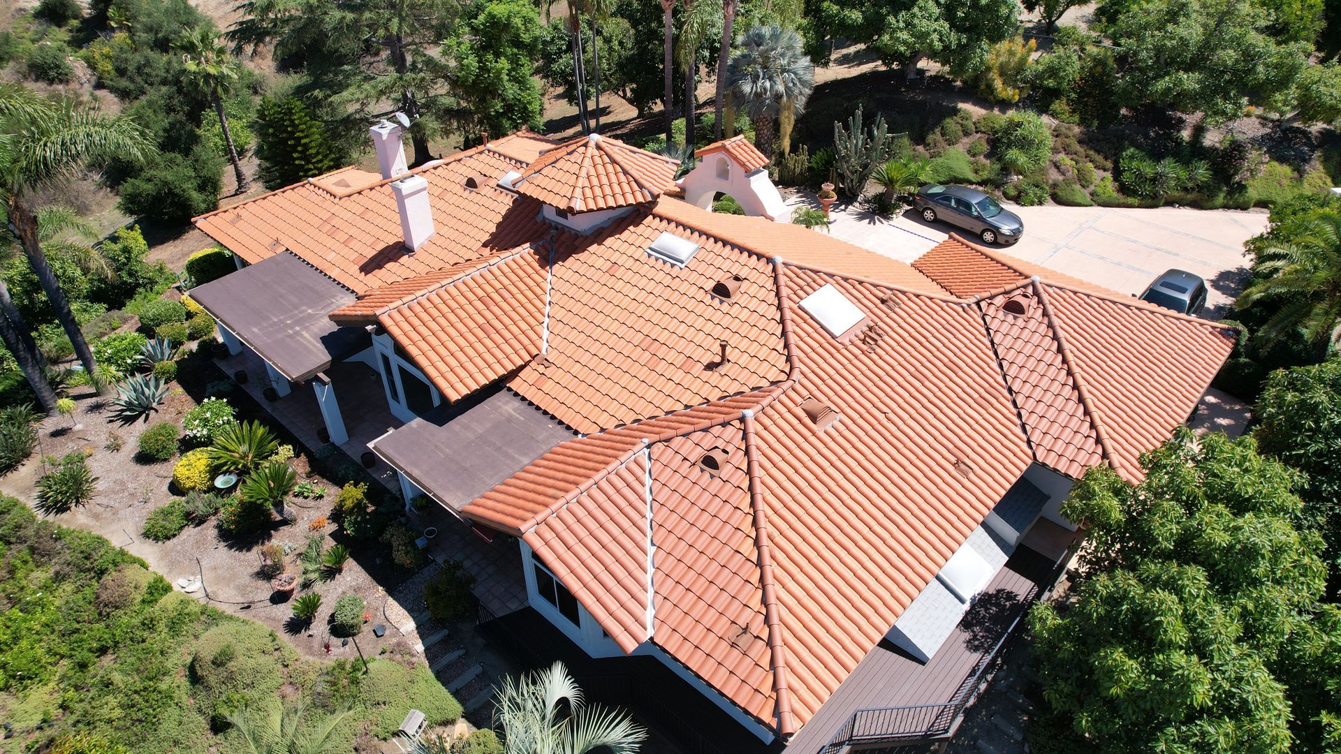 An aerial view of a house with a tiled roof