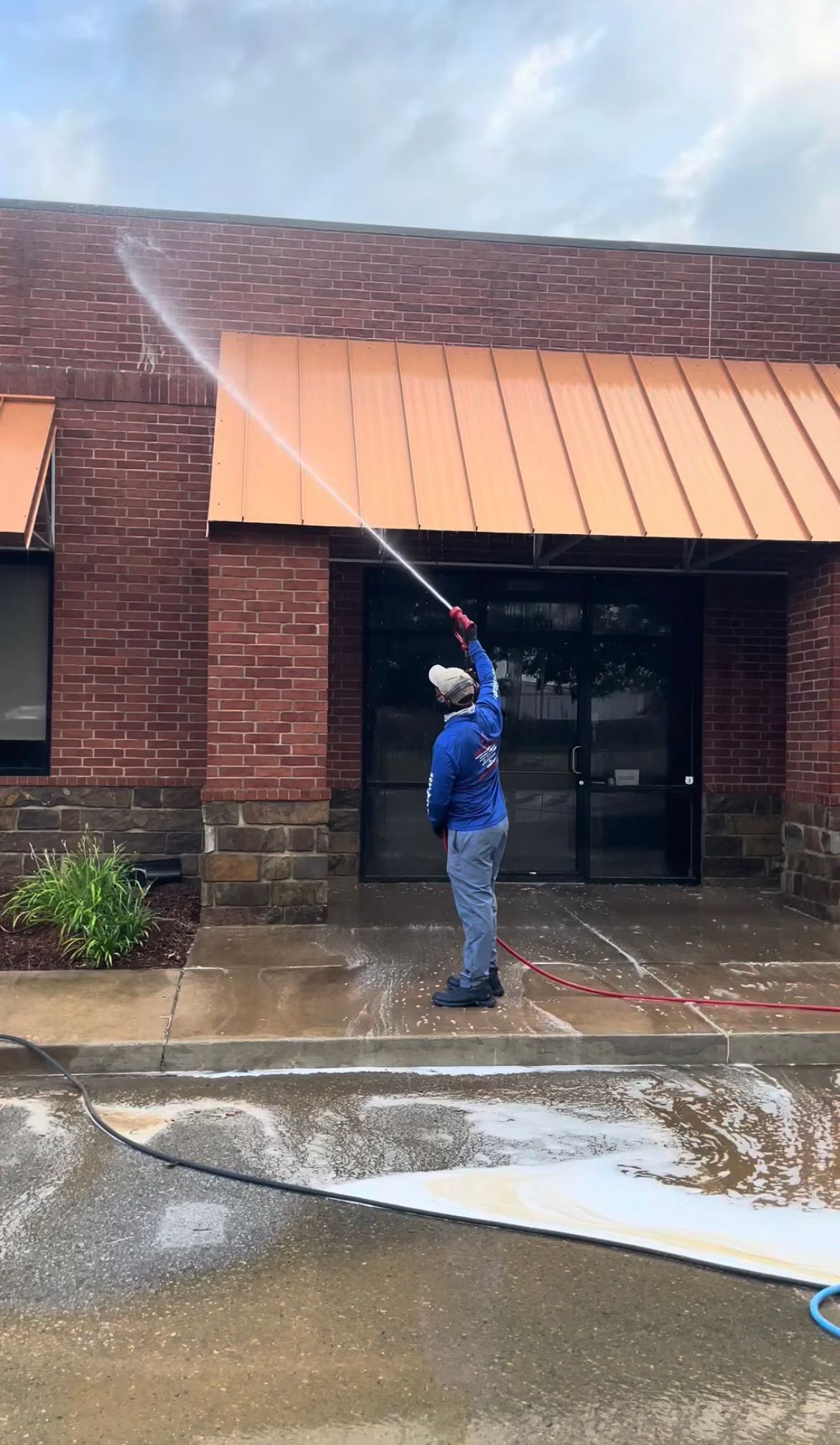 Four open paint cans on a white marble hexagon tile floor. Each can has a label.