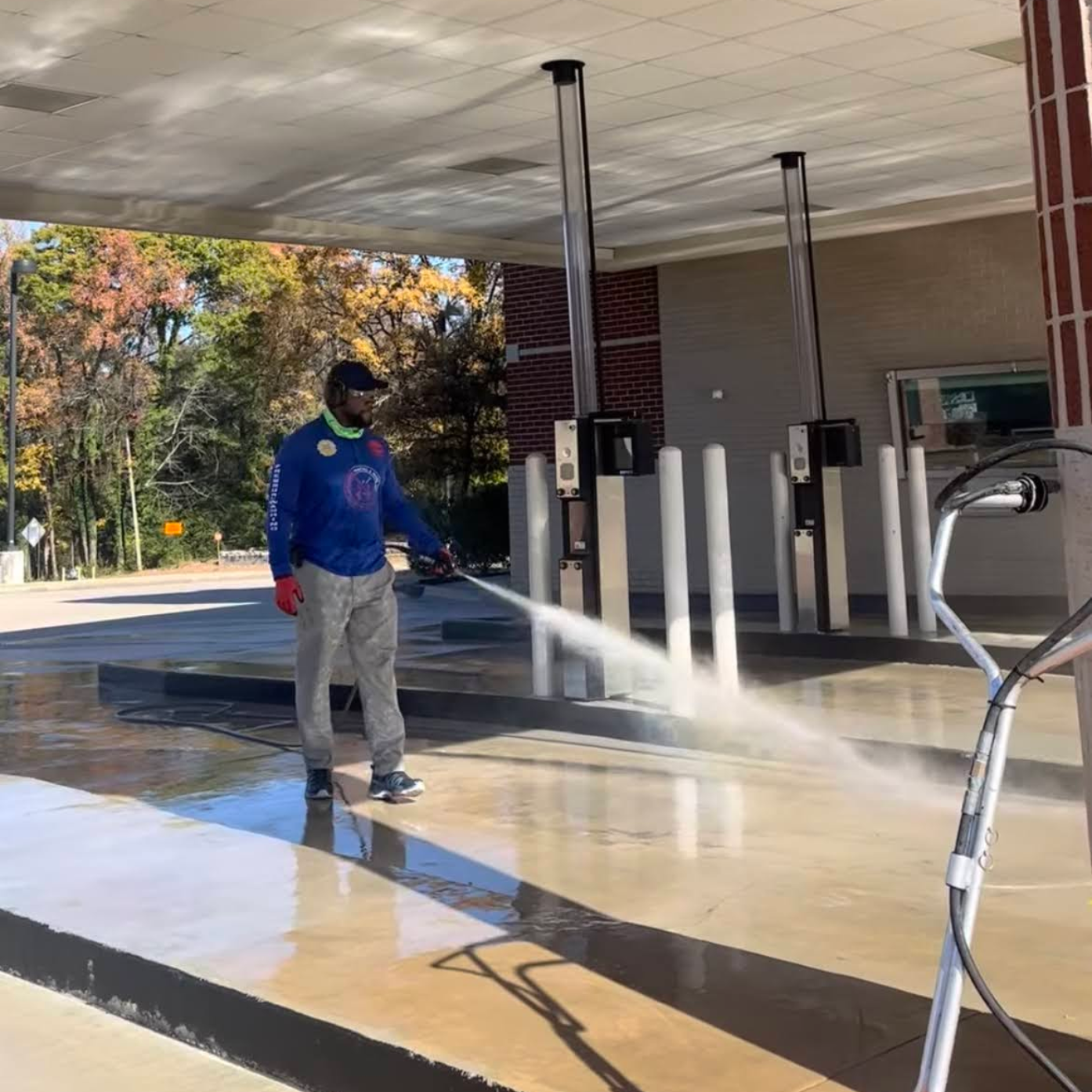 Blue storage unit doors numbered 9, 8, and 7, with yellow posts, set on a concrete surface.