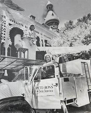 a black and white photo of a pete and rons tree service truck