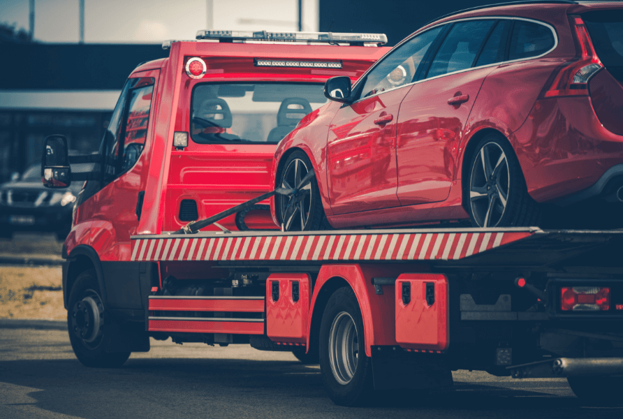 flat bed towing sugar hill ga- red car on flat bed tow truck