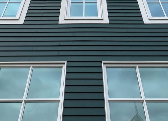 turqoise vinyl siding installation on two story residential home in West Springfield MA