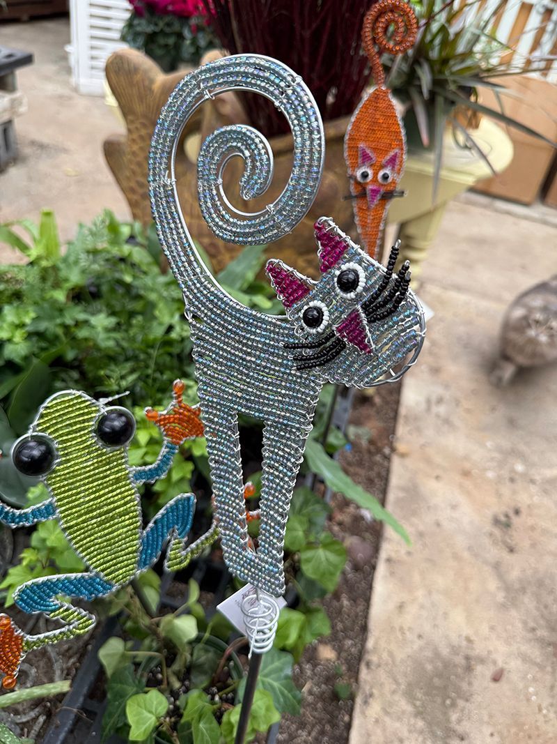 Beaded silver cat garden stake with pink ears and whiskers.
