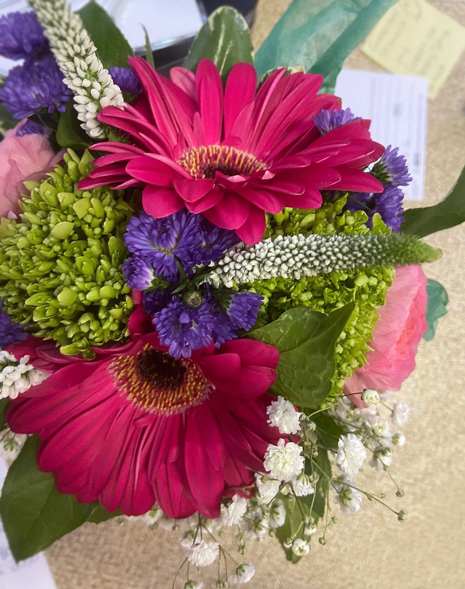 A close up of a bouquet of pink and purple flowers