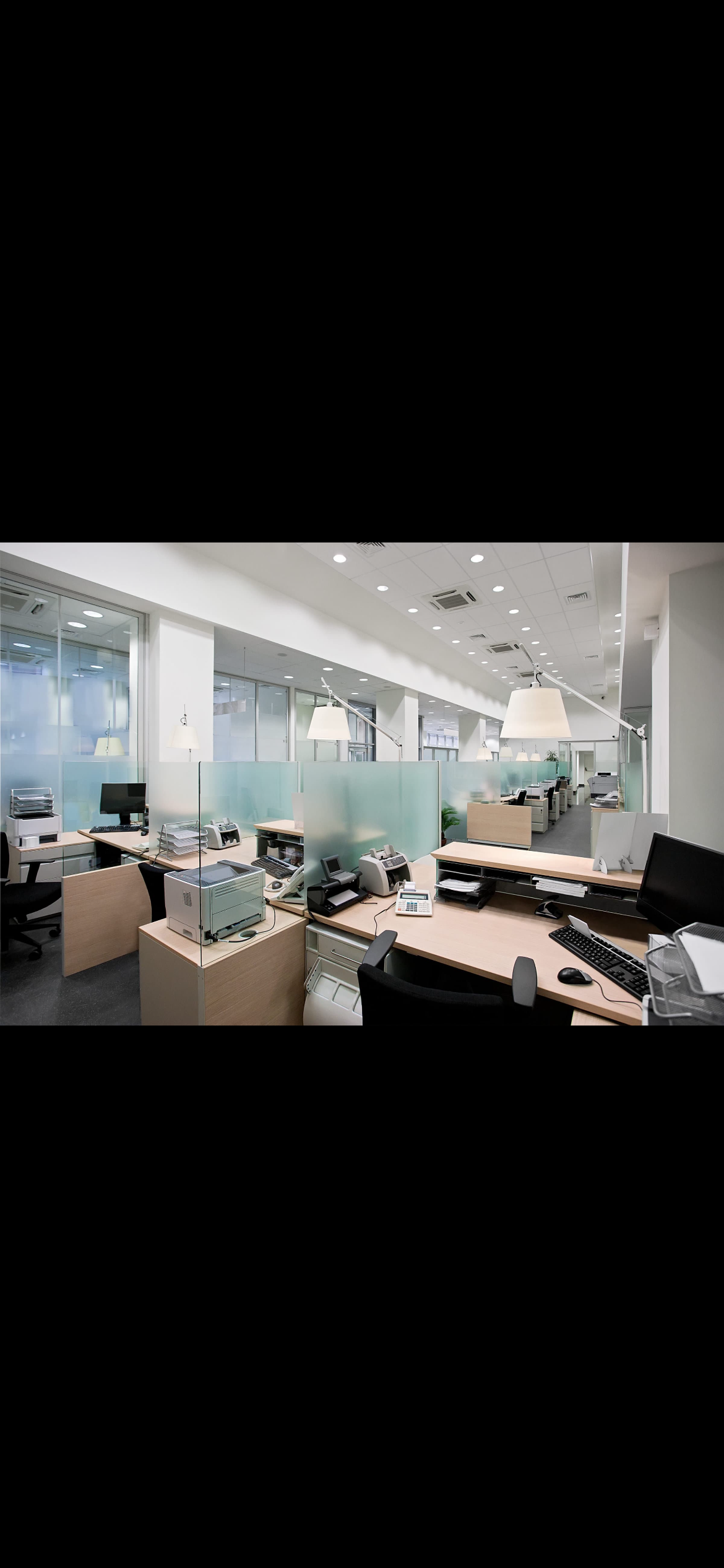 A row of washing machines in a laundromat