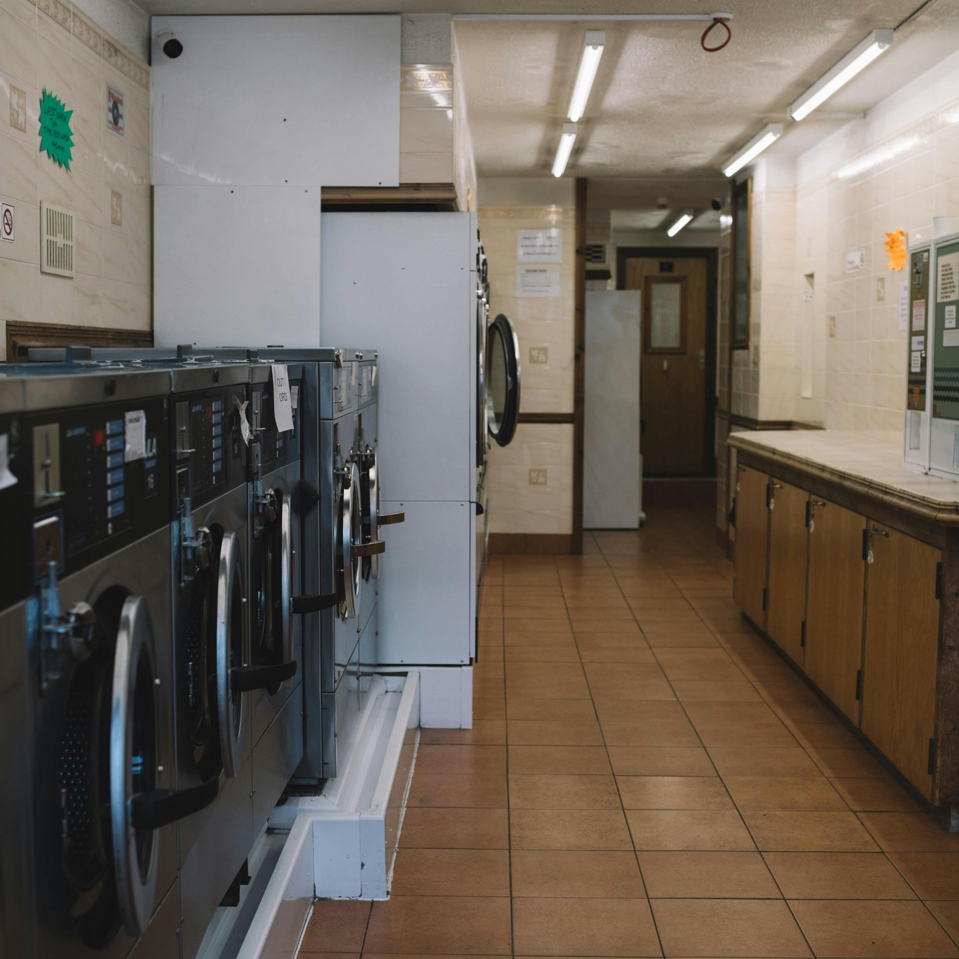 A row of washing machines in a laundromat