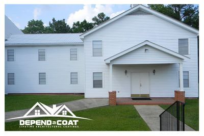 A white house with a sign that says depend a coat