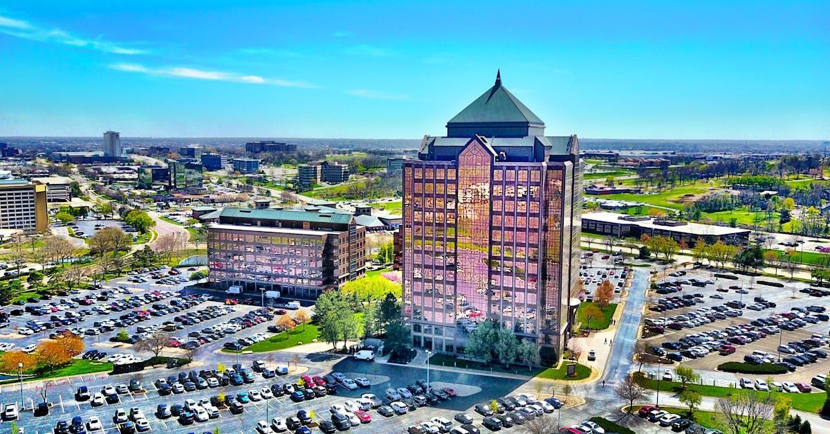 A city skyline with a bridge in the foreground and a river in the background