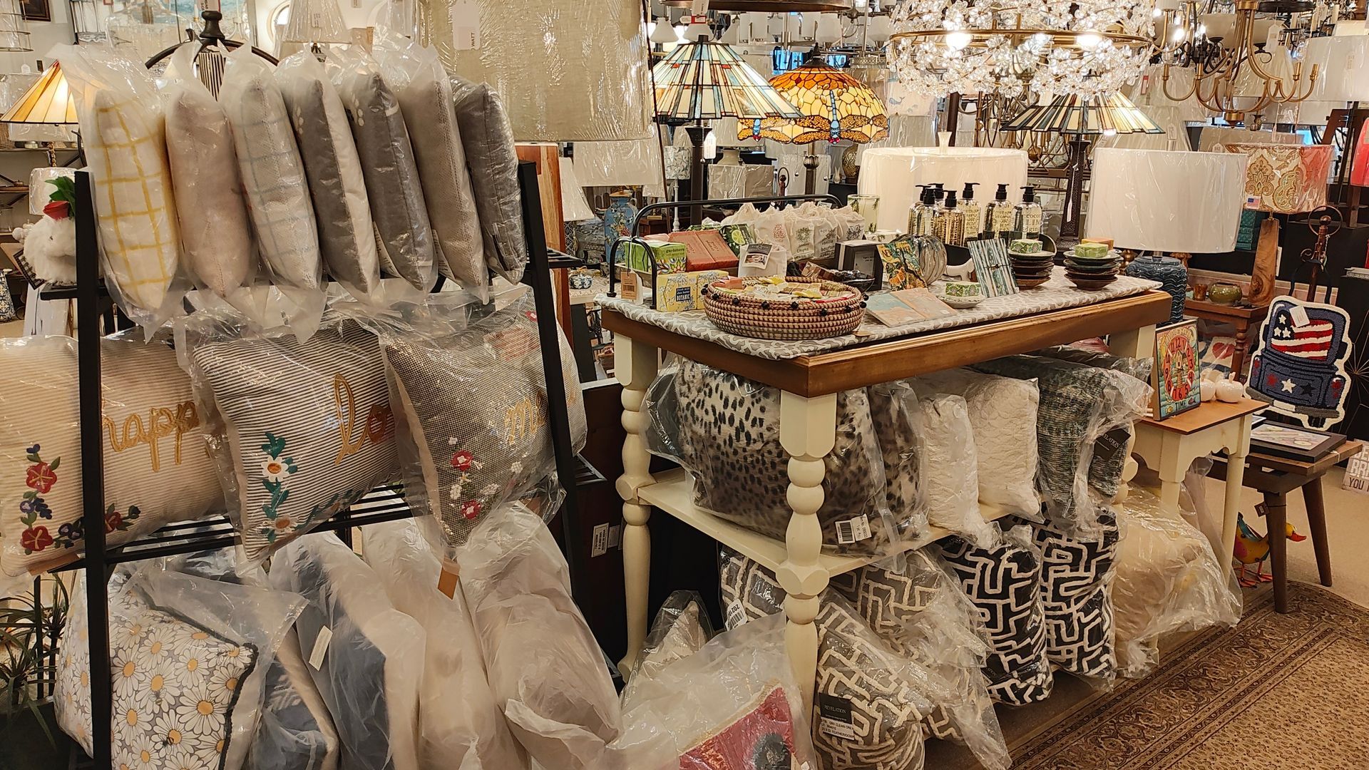 A store filled with lots of pillows and lamps.