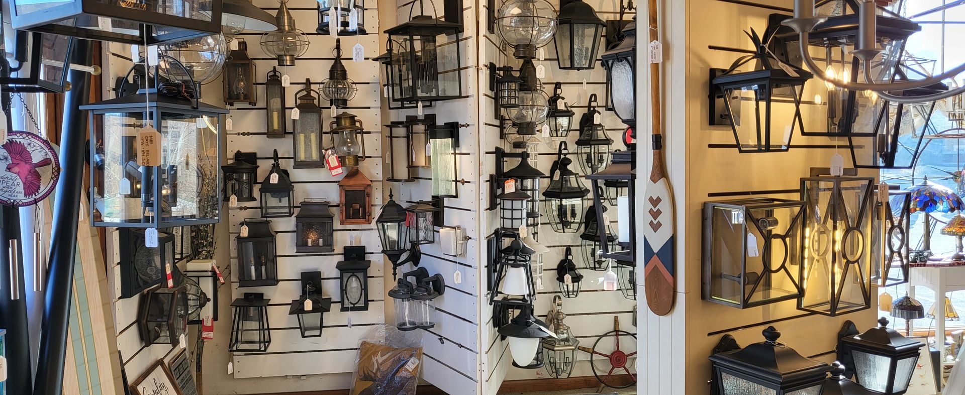 a display of exterior lanterns in a store with one that says buy me