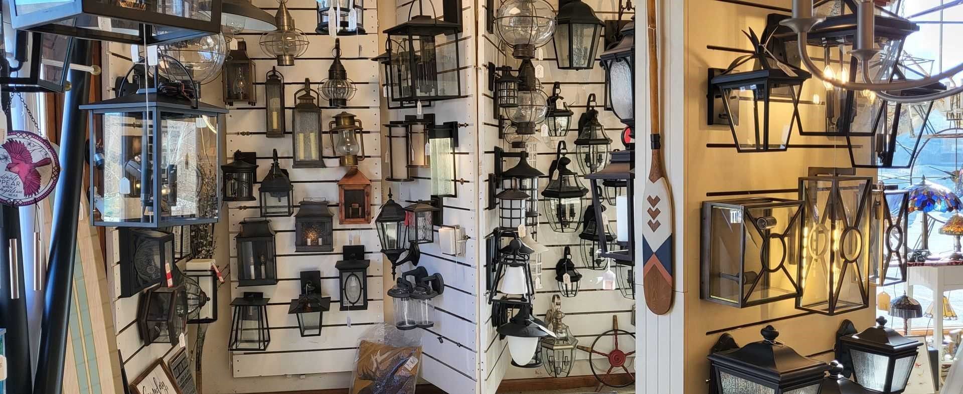 A store filled with lots of lanterns and lights on display.