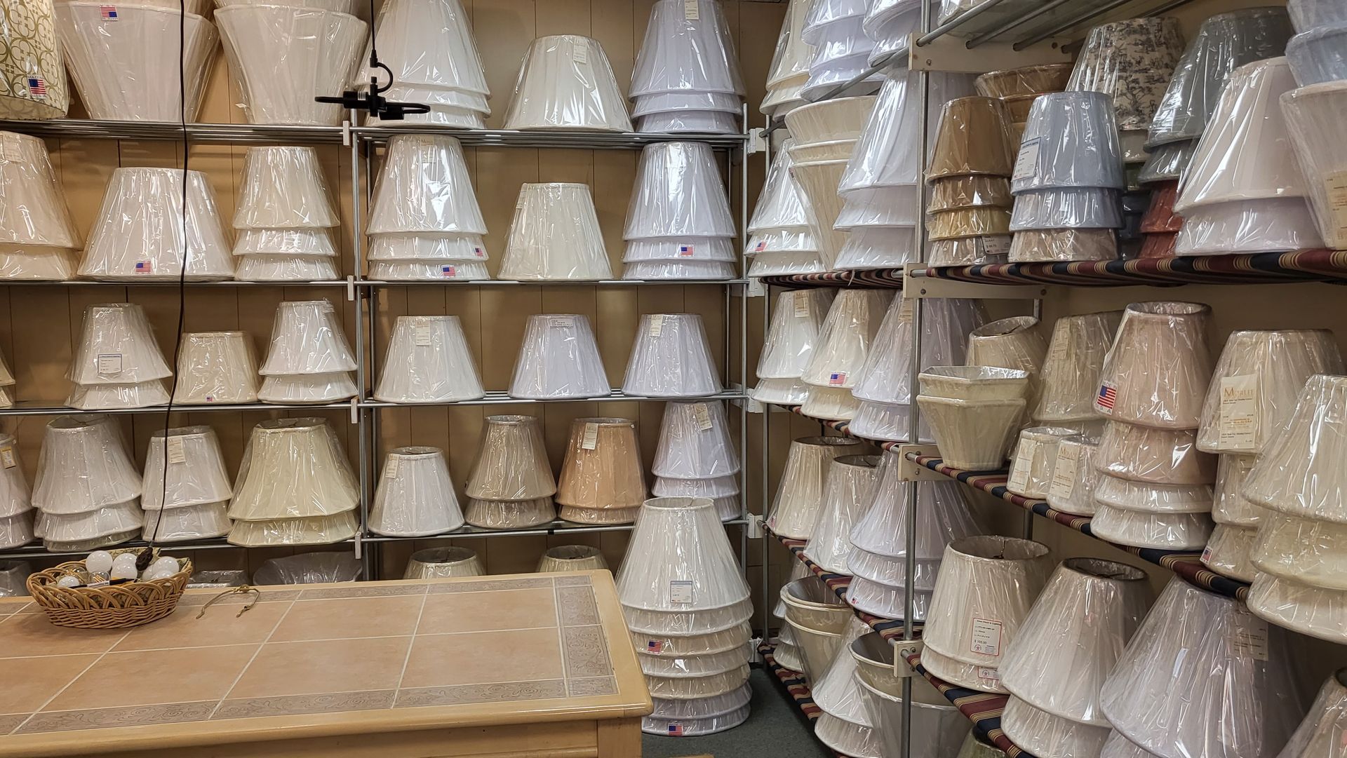 A store filled with lots of different types of lampshades.