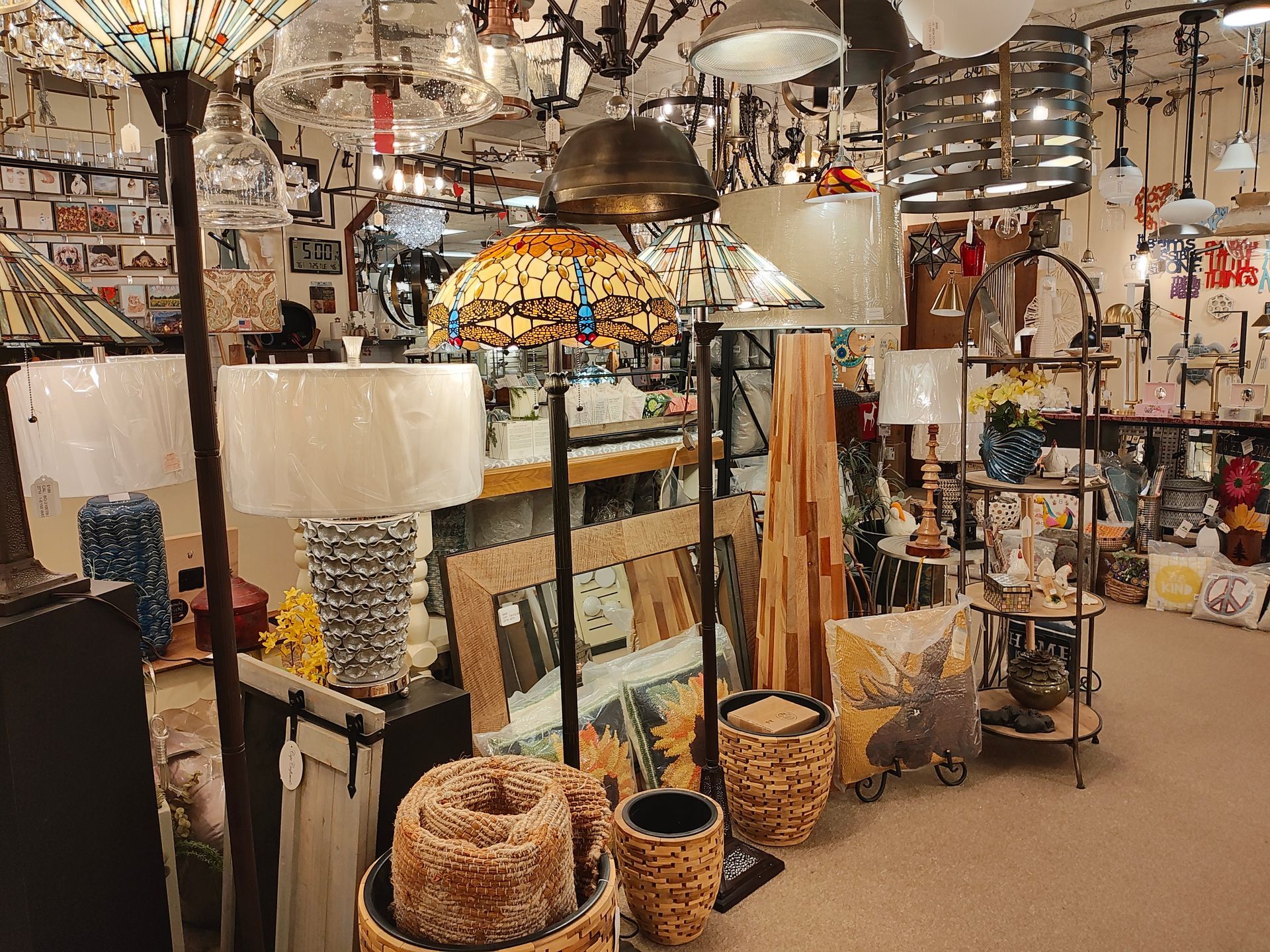 A store filled with lots of lamps and potted plants retail CT.