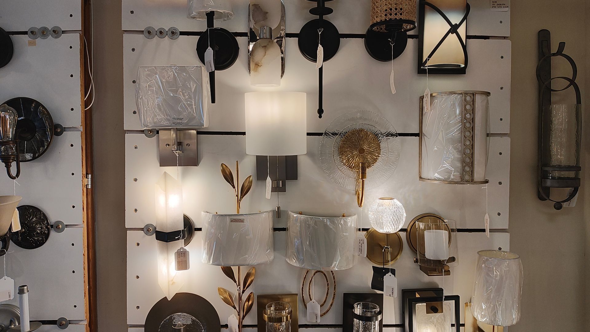 A wall with a lot of different types of lights on it in Avon, CT