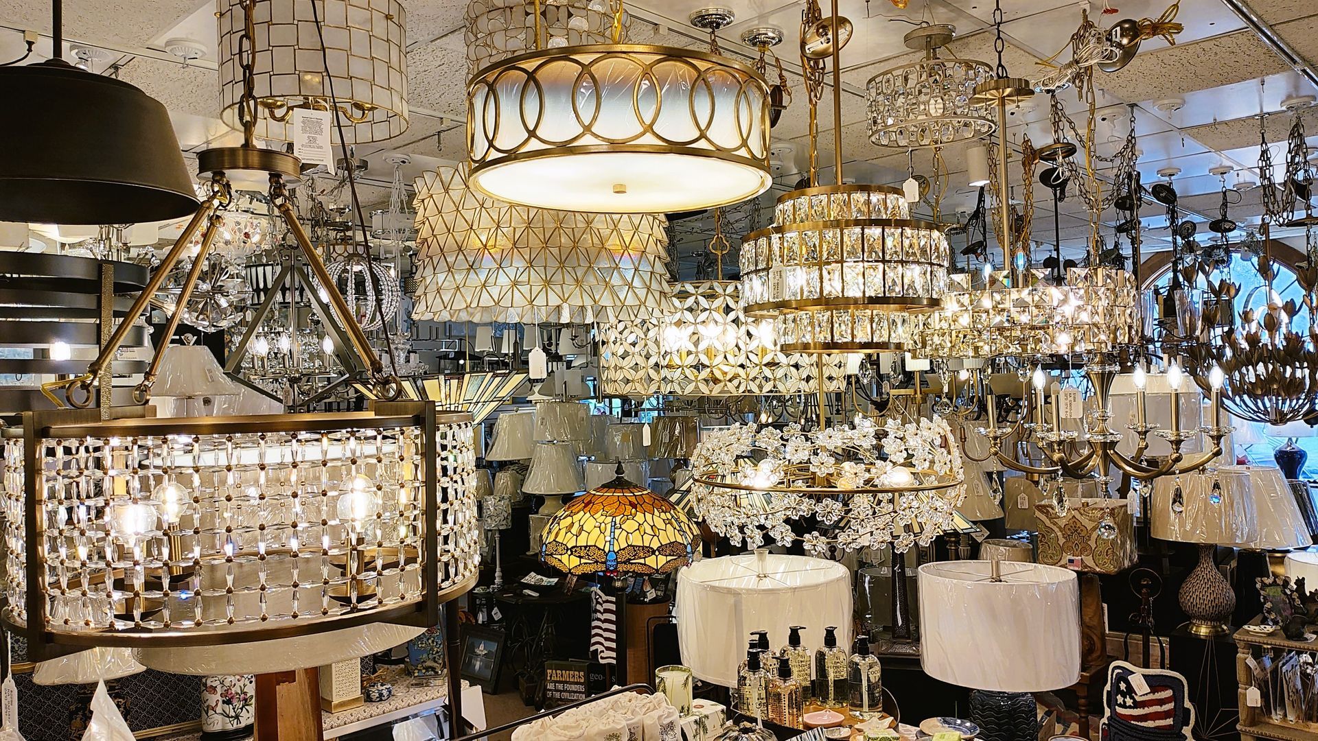 A local store filled with lots of chandeliers and lamps in Connecticut.
