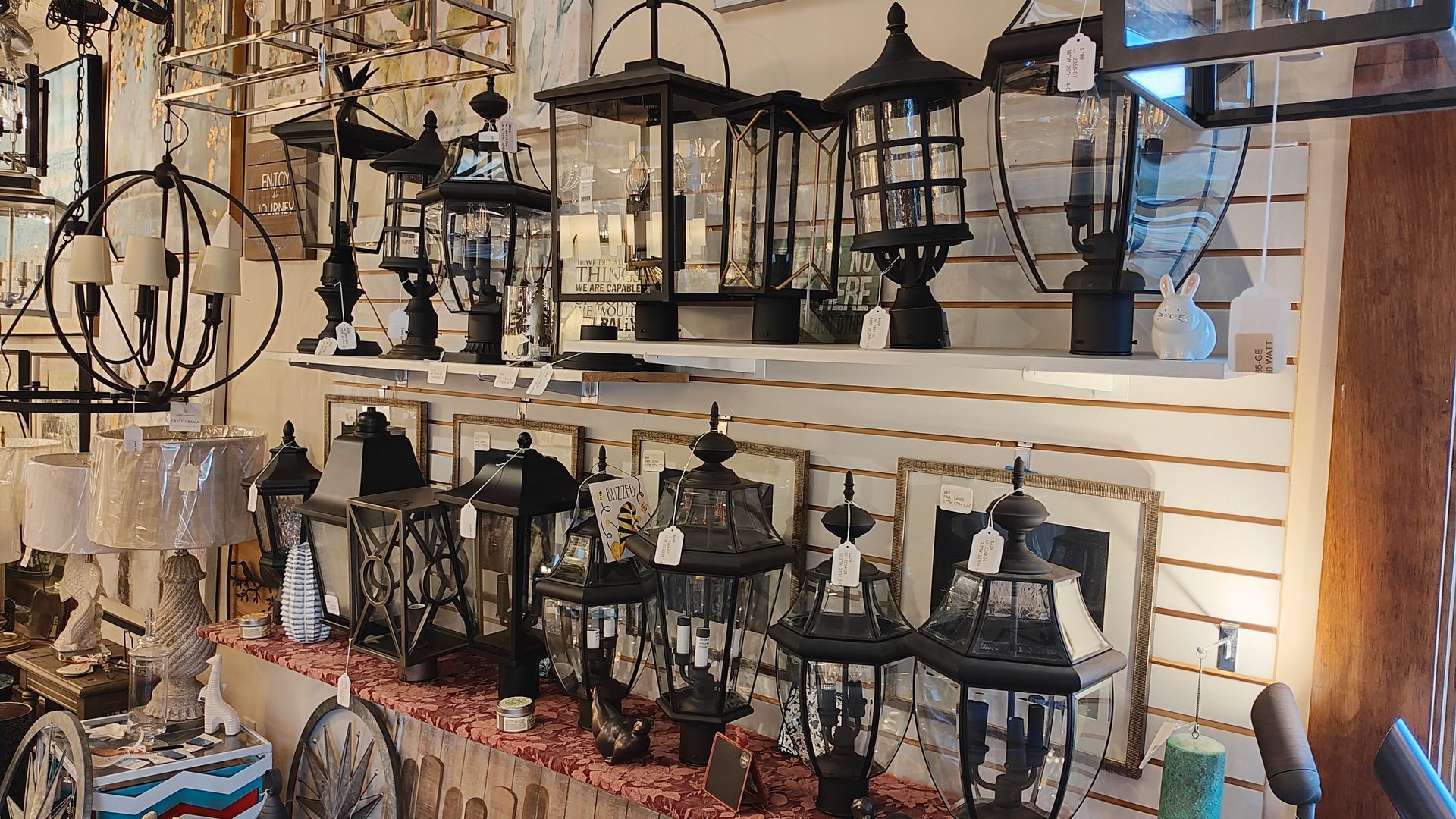 There are many different types of lanterns on display in this store.