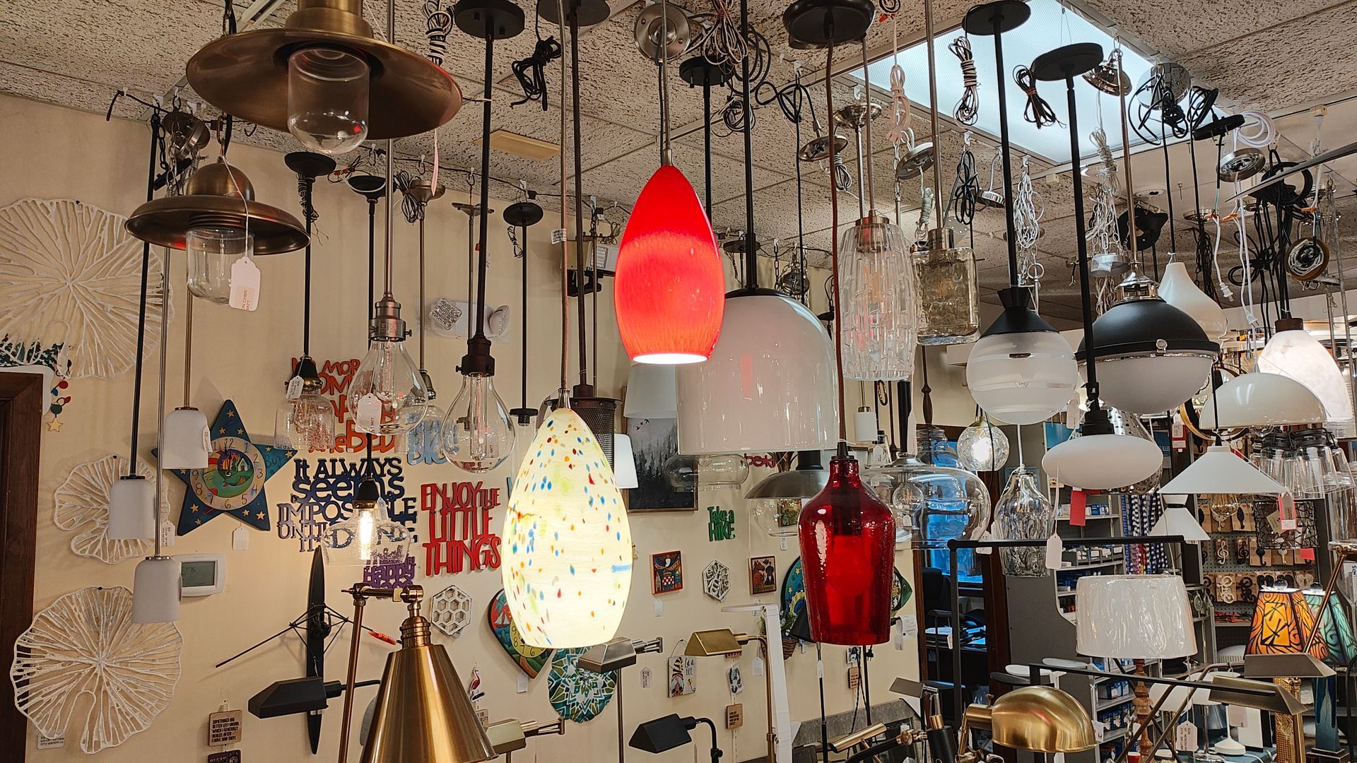 There are many different types of lights hanging from the ceiling. ct lighting local