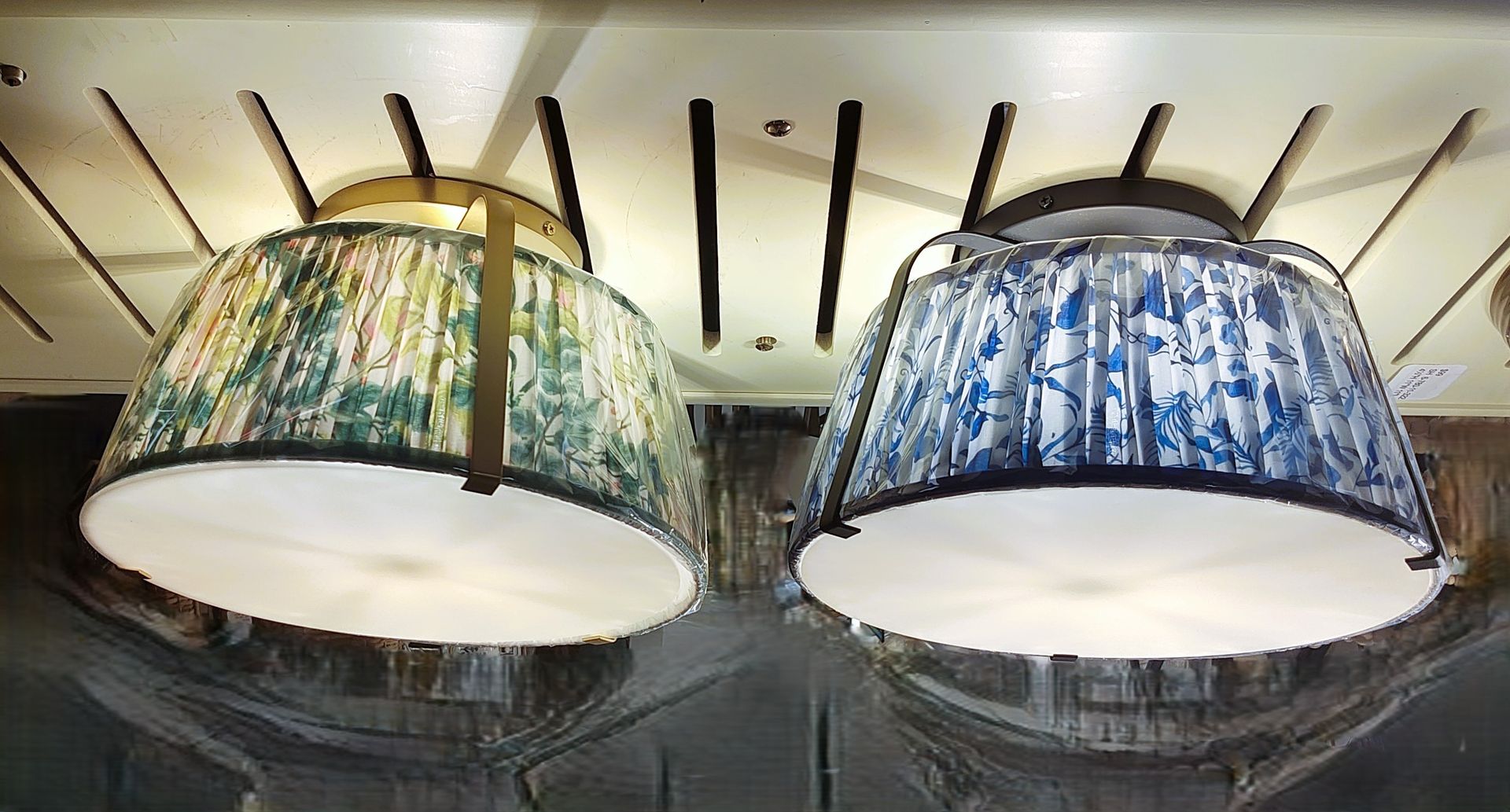 A bunch of lights are hanging from the ceiling in a lighting store in CT.