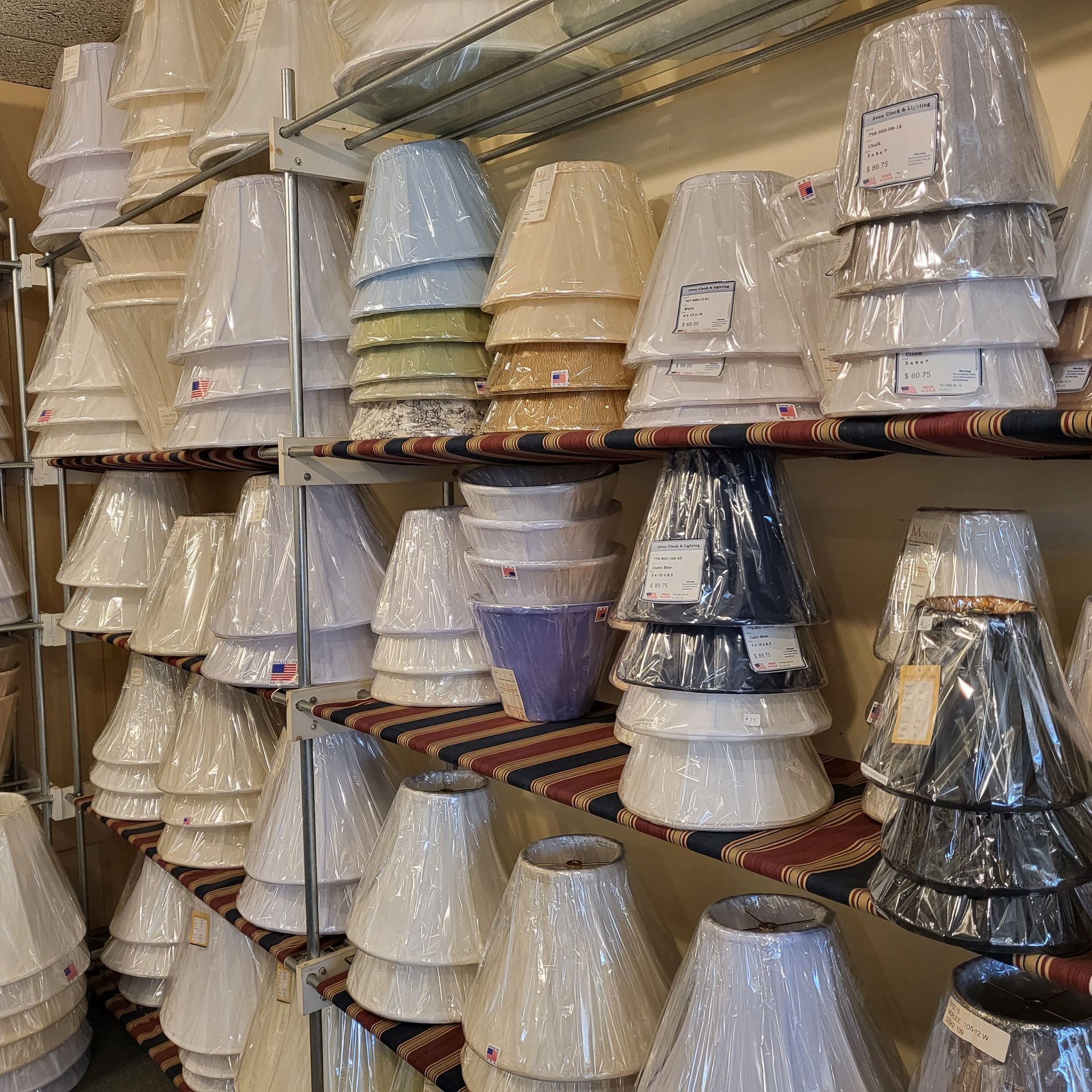 A bunch of lampshades are stacked on top of each other. CT lighting local