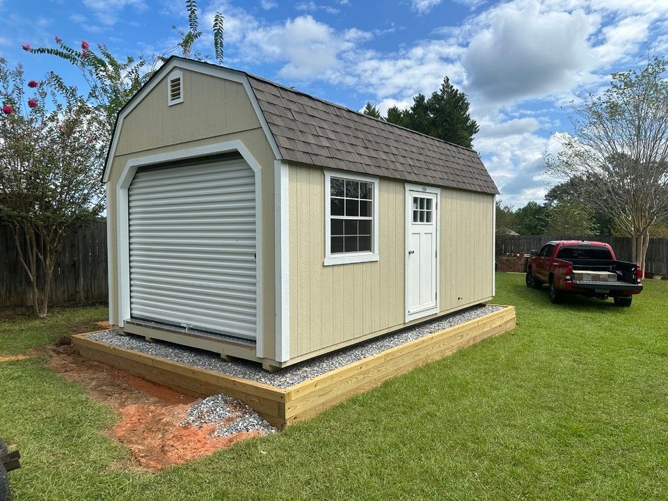 A compacted gravel pad prepared for a shed placement