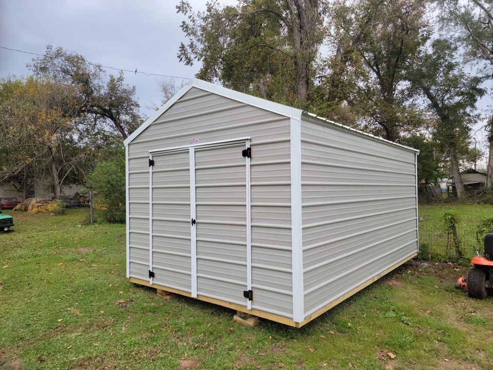 A green metal shed
