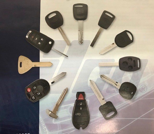 A bunch of car keys are arranged in a circle