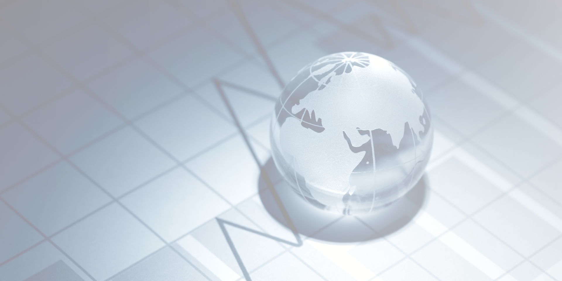 Graphic of a glass globe sitting on top of a graph depicting the economy