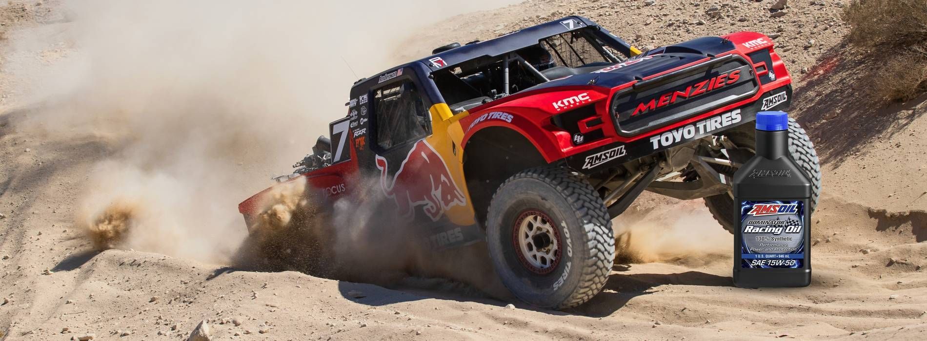 Car driving on highway with bottle of oil in foreground; city skyline in the background.