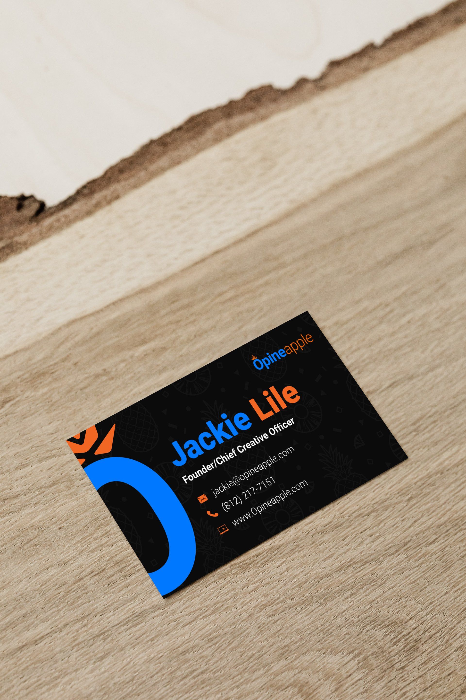 A business card on a desk.