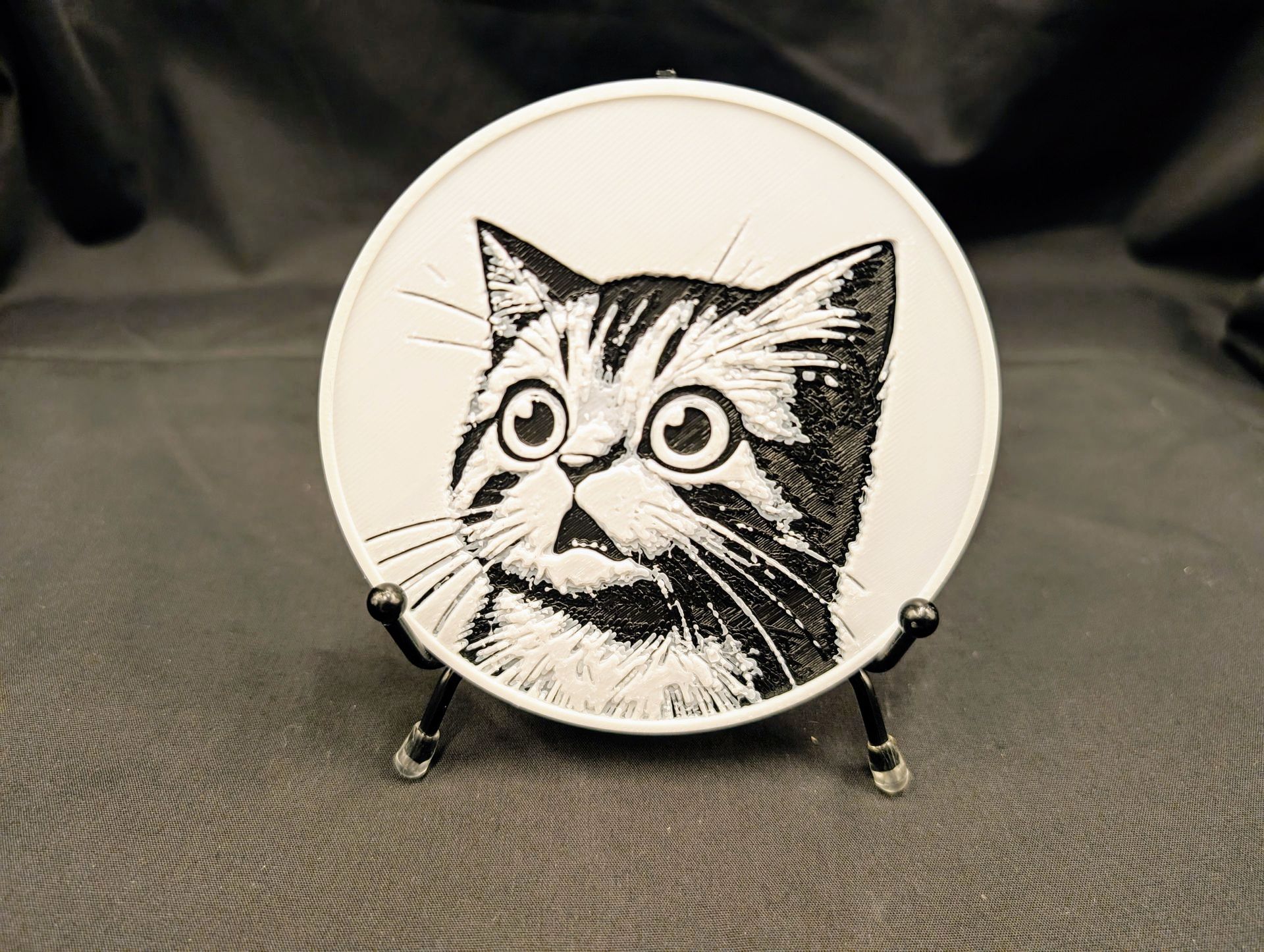 A coaster from a set of four. This one features a shocked cat named Sir Pounce-a-Lot.