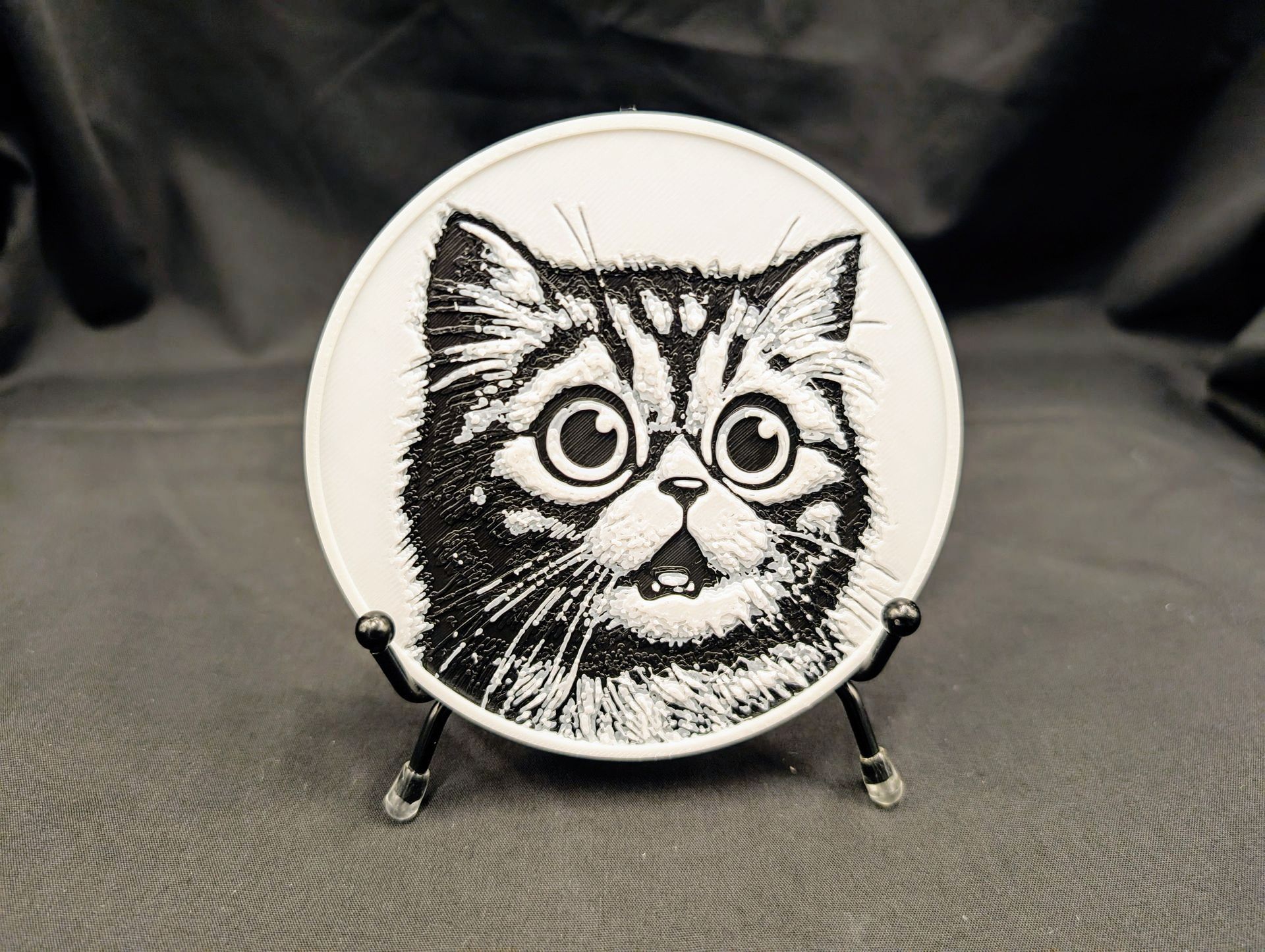 Cat coaster with a cute cat looking to the right.