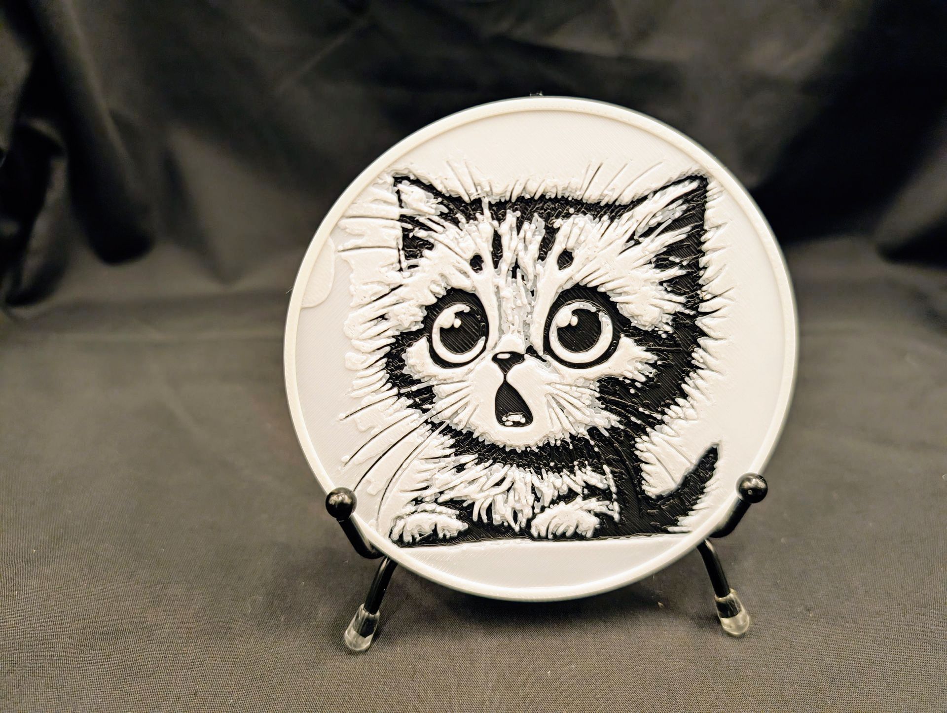 Cat coaster with a cute cat looking to the left.