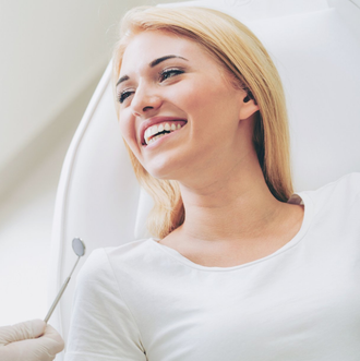 General Dentistry — Woman Having Teeth Examined in Fort Madison, IA