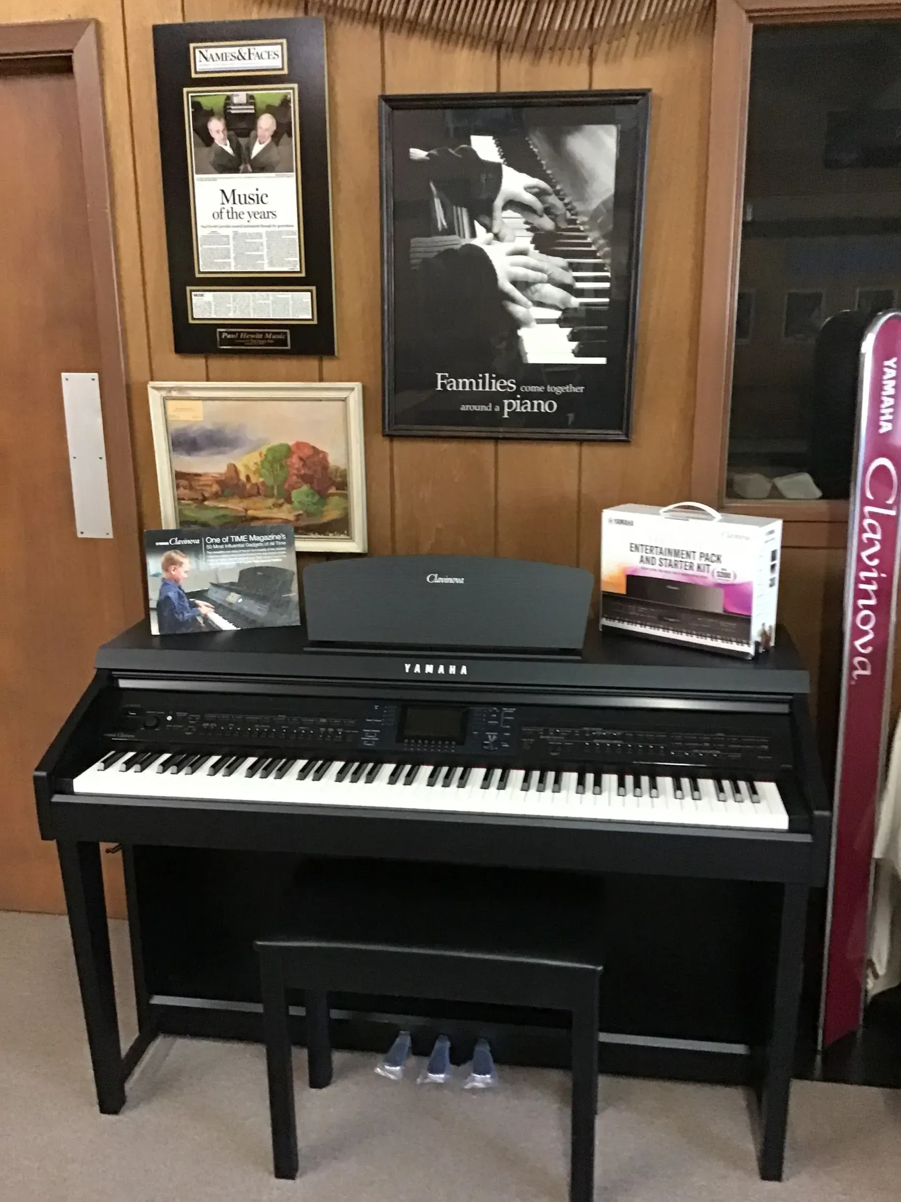A piano is sitting on top of a wooden table in a room.