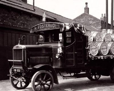 a black and white photo of an old foster truck