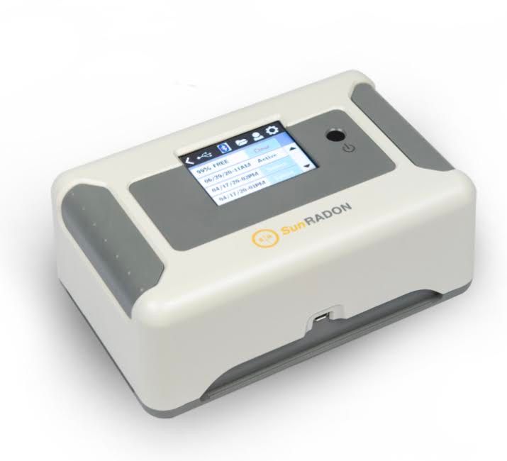 A white and gray device with a screen on it.