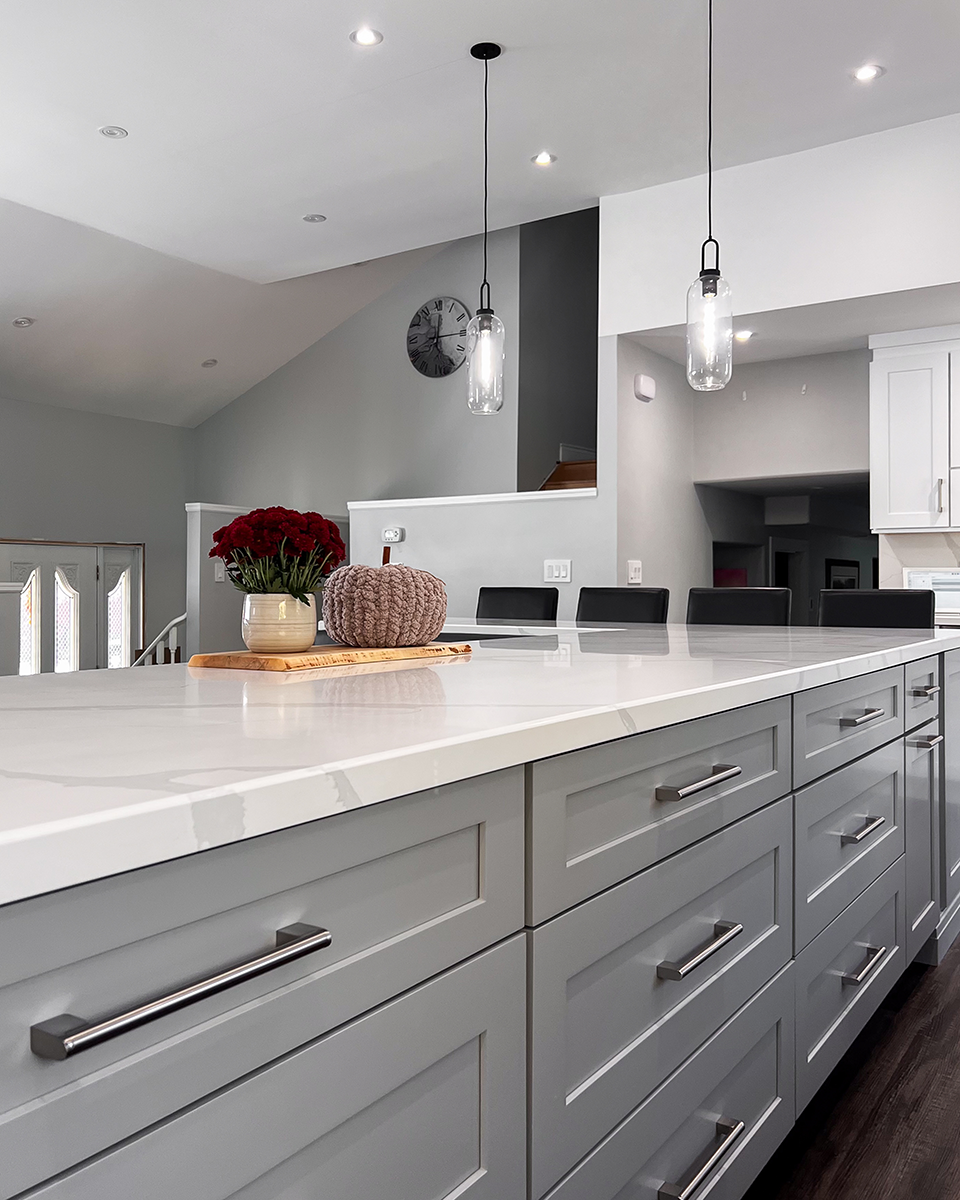 A wooden sauna with a view of a lake.