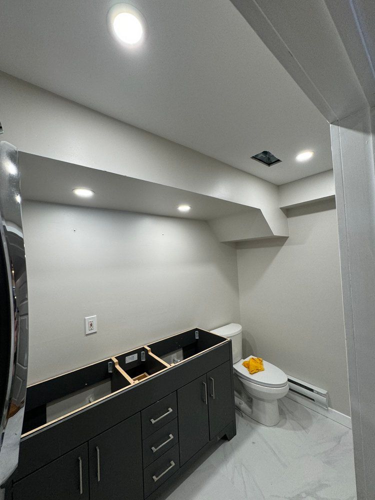 A bathroom with a sink and toilet in it