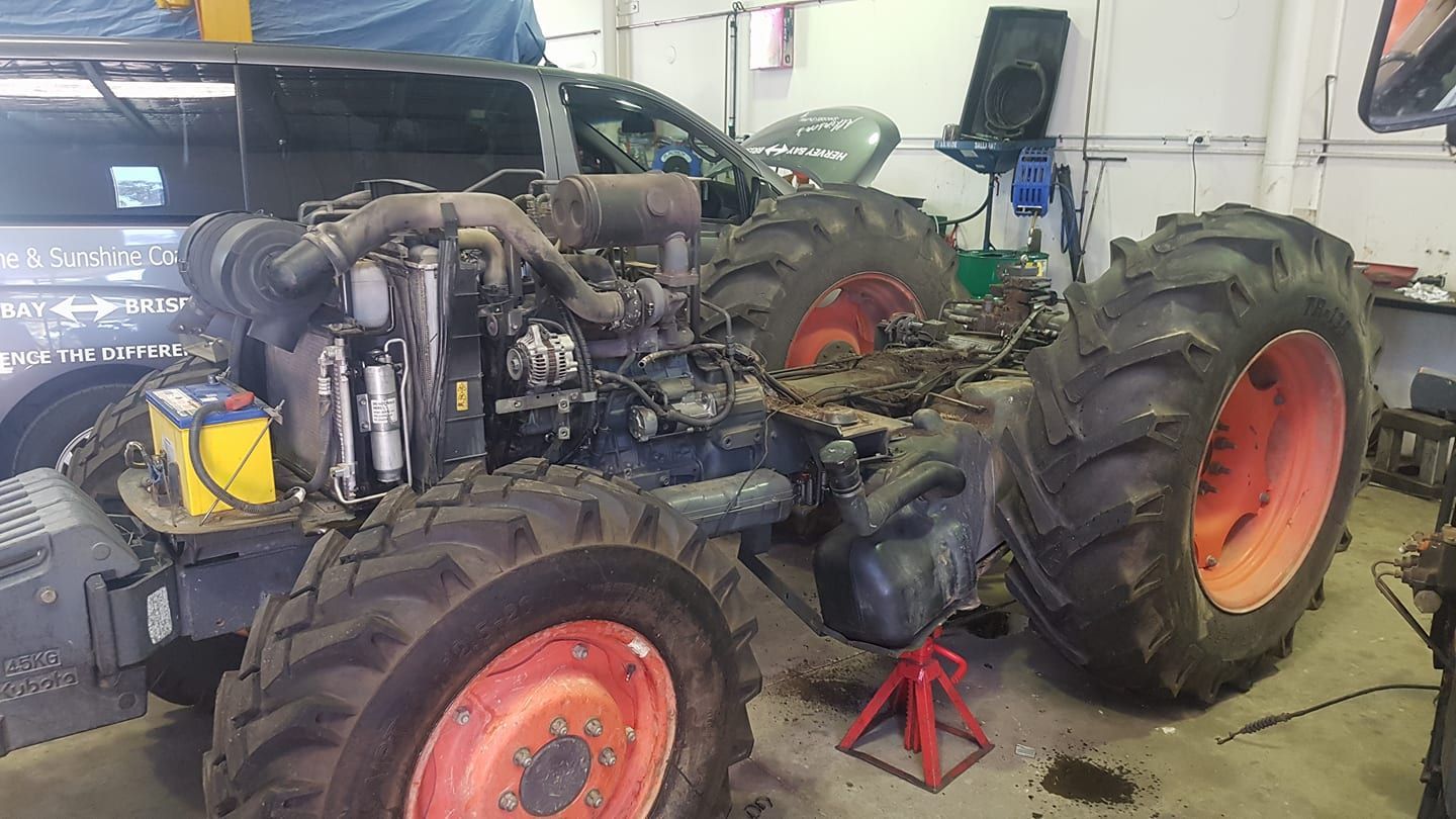 Tractor With Exposed Engine, Being Repaired in a Garage — R&B Automotive PTY LTD In Fraser Coast, QLD