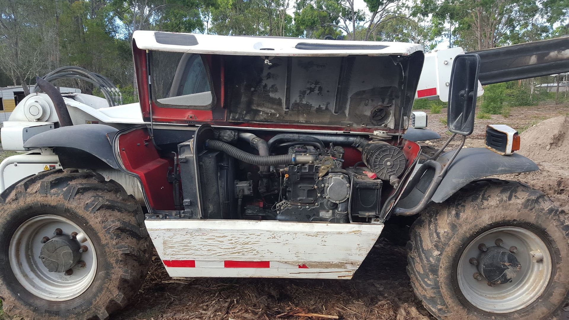 A Dirty Telehandler With Its Engine Compartment Open — R&B Automotive PTY LTD In Urangan, QLD