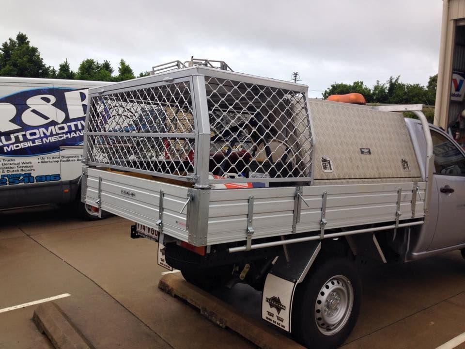 Silver Utility Truck With a Caged Bed and Canopy — R&B Automotive PTY LTD In Urangan, QLD