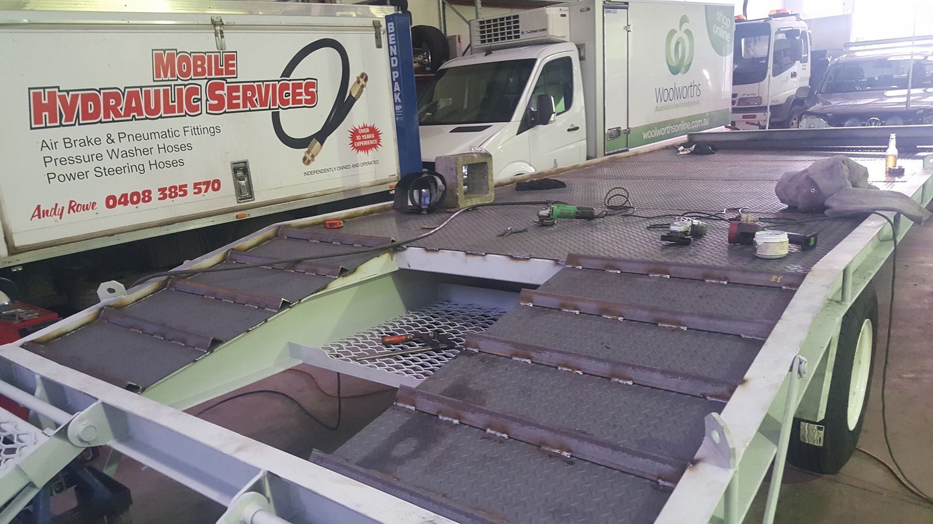 Flatbed Trailer Inside a Repair Shop — R&B Automotive PTY LTD In Urangan, QLD